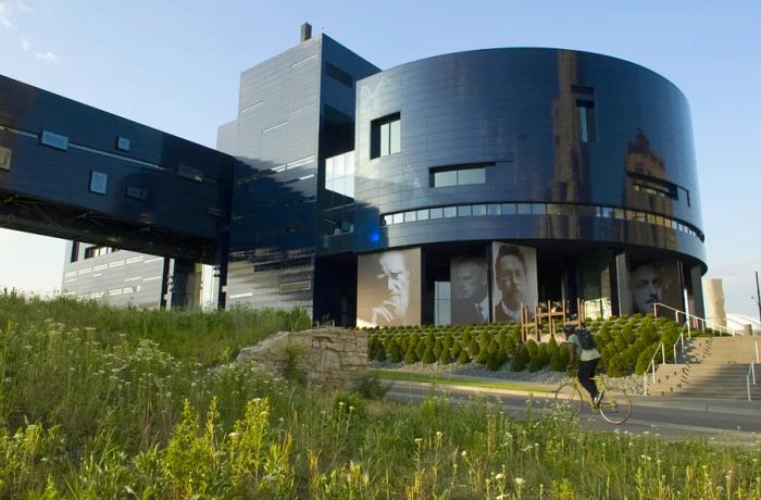 A glimpse of the sleek, round, black exterior of the Guthrie Theater in Minneapolis, Minnesota