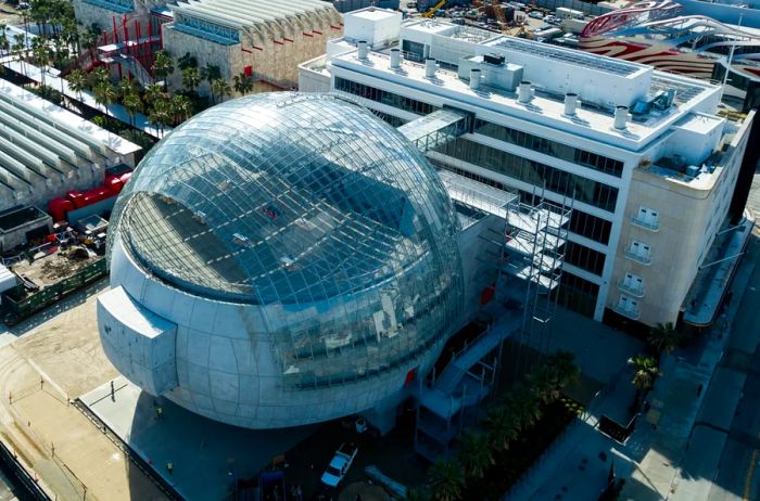 An aerial view of the Academy Museum of Motion Pictures alongside its uniquely designed spherical theater in Los Angeles.