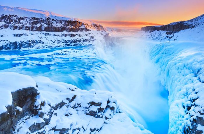 Snow enhances the beauty of Gullfoss Falls.