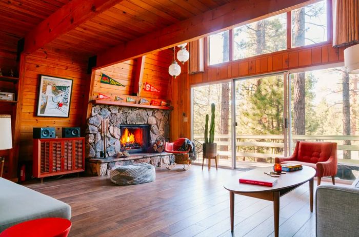 Interior of a retro cabin featuring a stone fireplace