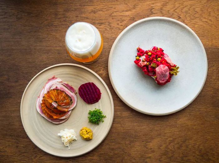 Stylish minimalist plates of plant-based dishes at Barr restaurant in Copenhagen, Denmark.