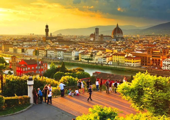 Italy, Tuscany, Florence district, a sunset view over the city featuring Palazzo Vecchio and the Cathedral (Duomo Santa Maria del Fiore) as seen from Michelangelo Square.