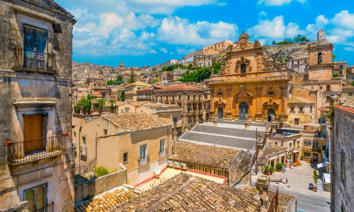 A picturesque view in Modica featuring the Cathedral of San Pietro alongside the Duomo of San Giorgio. Sicily, southern Italy.