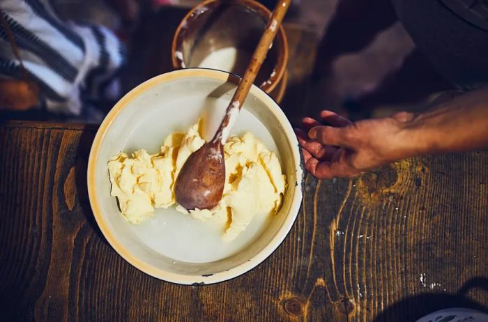 A bowl of freshly churned butter alongside whey in Iceland.