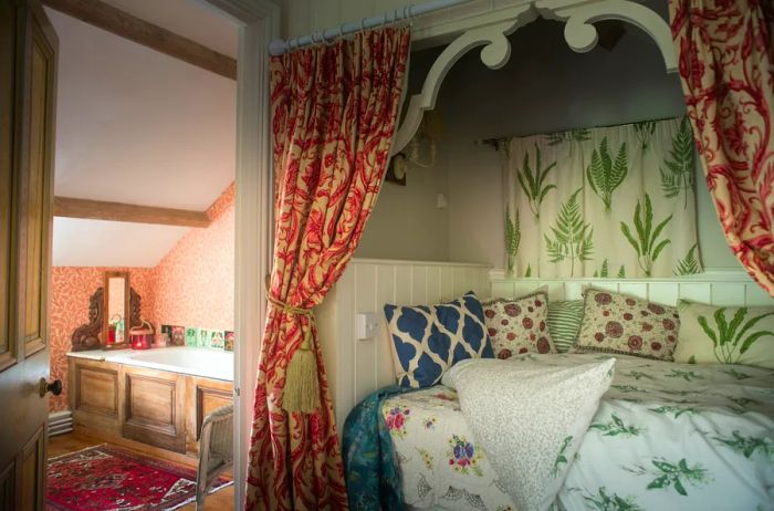 Cozy bedroom adorned with botanical-printed linens inside an Airbnb in Wales