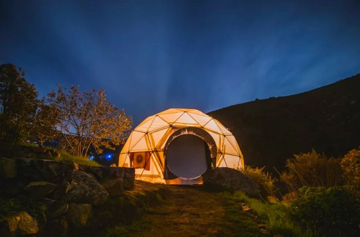 Geodesic dome Airbnb at night in the wilderness