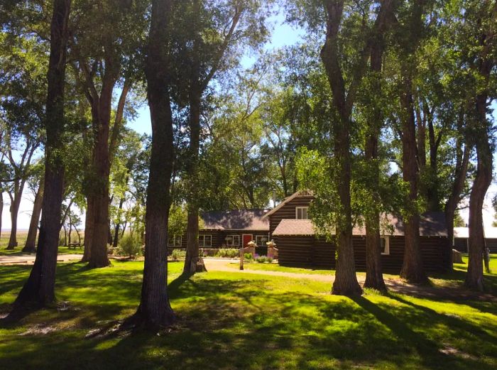 The lodge at Zapata Ranch nestled among towering cottonwoods