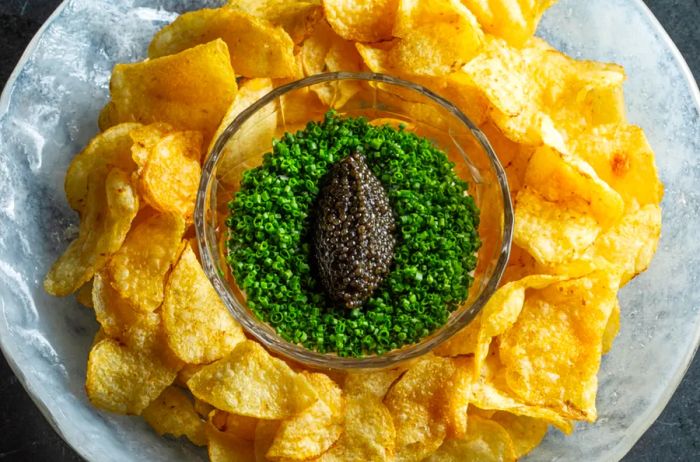 Regiis Ova caviar served with chips and dip.