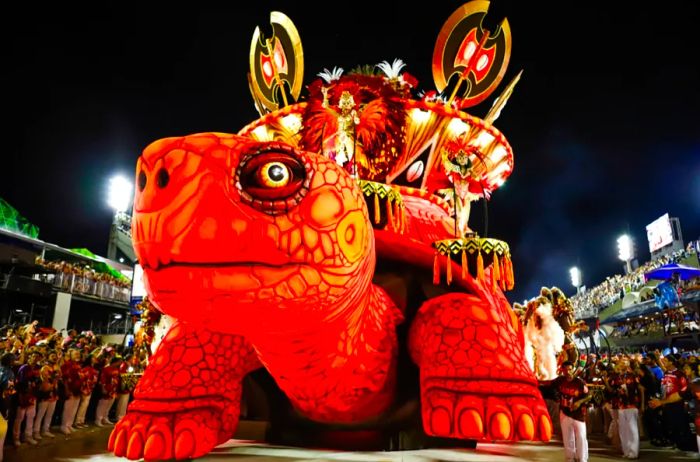 An orange turtle float from the samba school 'Academicos do Salgueiro' during a parade in the Sambadrome.