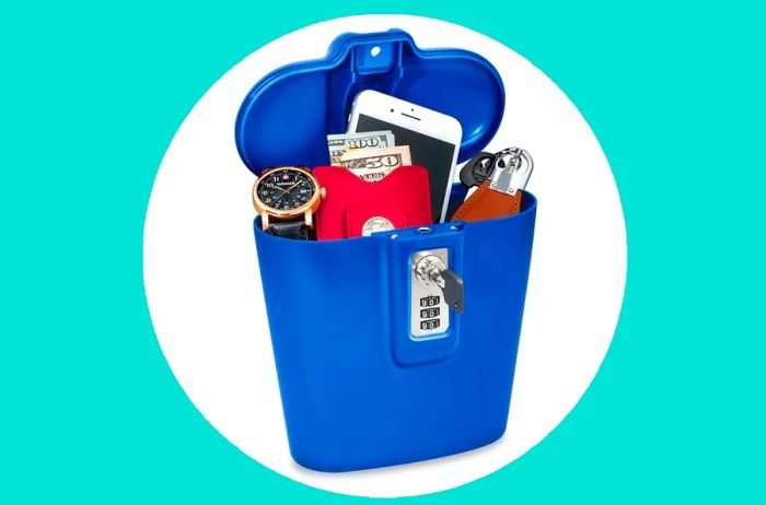 Safego Portable Travel Lock Box Safe in blue, containing a watch, cash, cell phone, and key