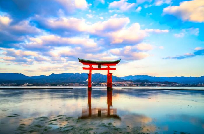 Long exposure shot of the Floating Torii gate at Itsukushima Shrine on Miyajima, Hiroshima (the gate sign reads Itsukushima Shrine).