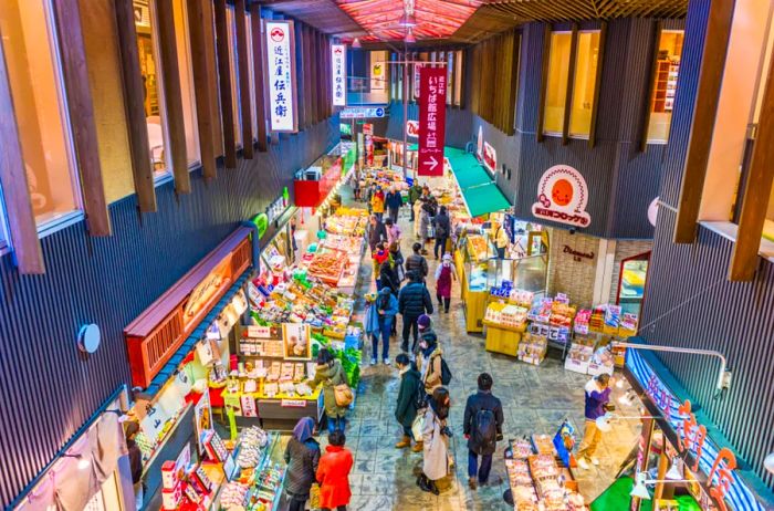 Early morning shoppers explore fresh seafood at the Omicho Market.