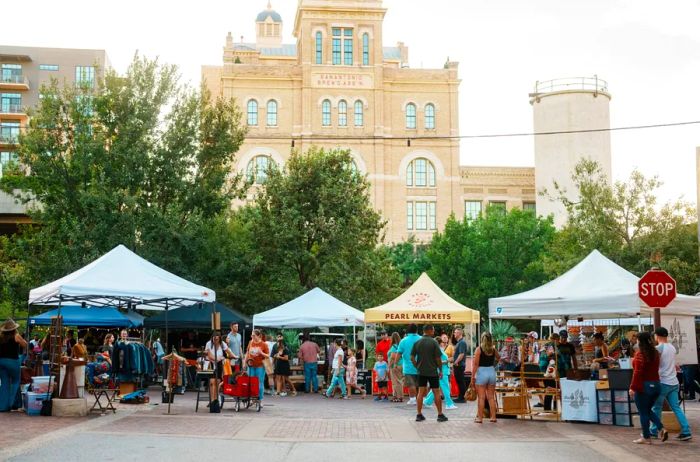 A row of tents at San Antonio's Pearl Farmers' Market