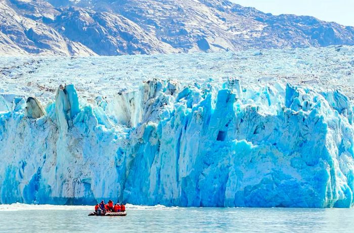 Cruise Passengers Near a Glacier