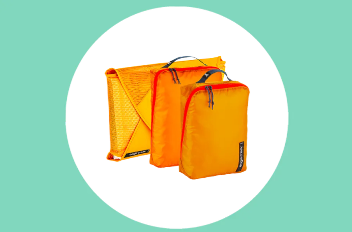 Set of three Eagle Creek packing cubes in yellow, available in various sizes