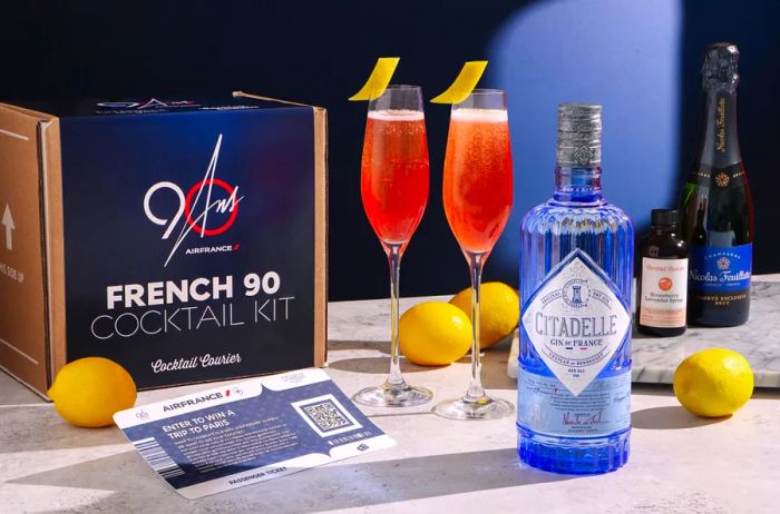 Enjoy an Air France cocktail kit, complete with four lemons, gin, champagne, and two flutes brimming with a delightful pink cocktail.