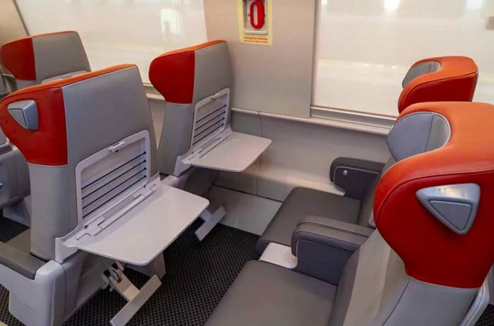 Acela first-class seats not only provide more space and legroom but also feature personal tray tables that can be used independently from neighboring passengers.