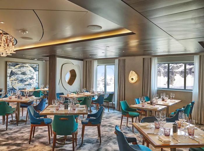 A vacant restaurant with polar vistas on Silversea's luxury expedition ship, 