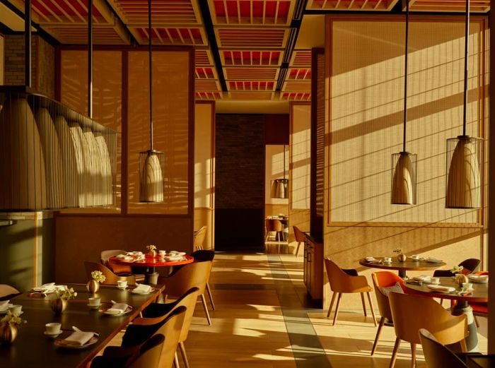 Hu Jing restaurant in Janu Tokyo boasts low-hanging ceiling lights, a blond wood-clad interior, and a grid ceiling accented with red lacquer.