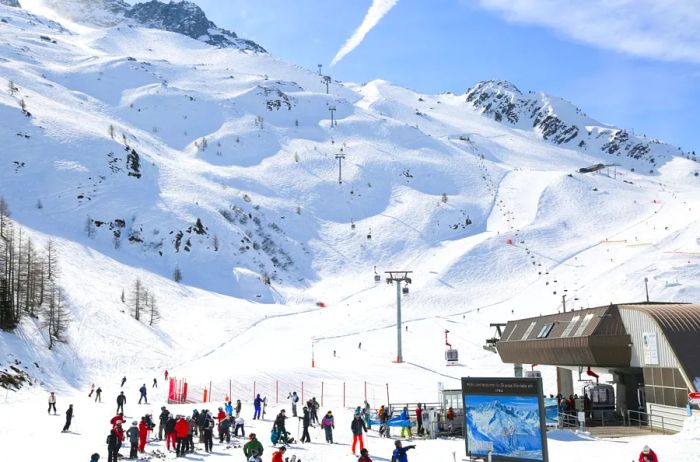 Skiers at the base of a snow-covered mountain