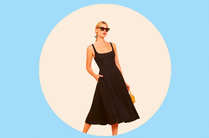 Blonde model sporting sunglasses and a sleek black jersey tank dress