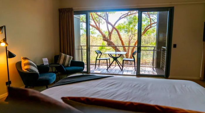 A guest room featuring a balcony at Cicada Lodge in Nitmiluk National Park