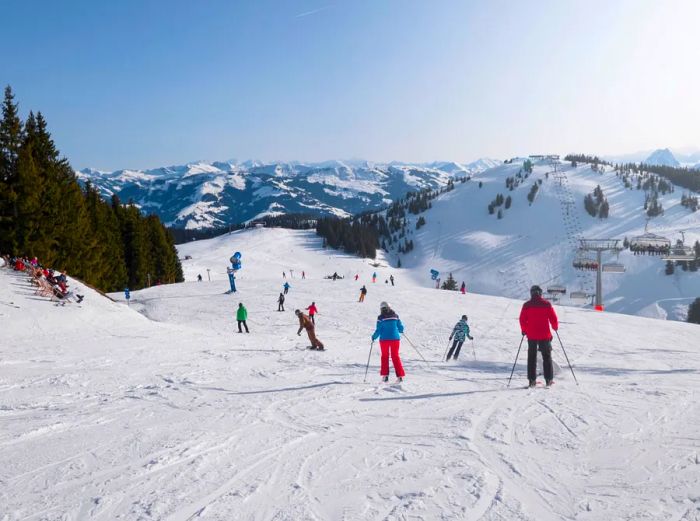 Skiers and snowboarders enjoying the slopes.