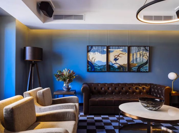 The parlor at The Tasman adorned in soothing shades of blue