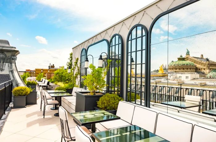 Experience breathtaking views of Paris from the Sequoia rooftop bar at the Kimpton St Honoré.