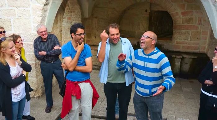 Aziz Abu Sarah (wearing a blue t-shirt) alongside two guides in Israel