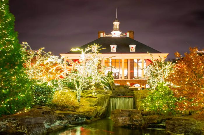 The entrance of the Gaylord Opryland Hotel illuminated at night with Christmas lights in a long exposure shot.