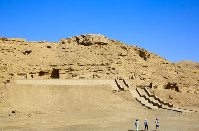 A few visitors outside the tombs at El Kab