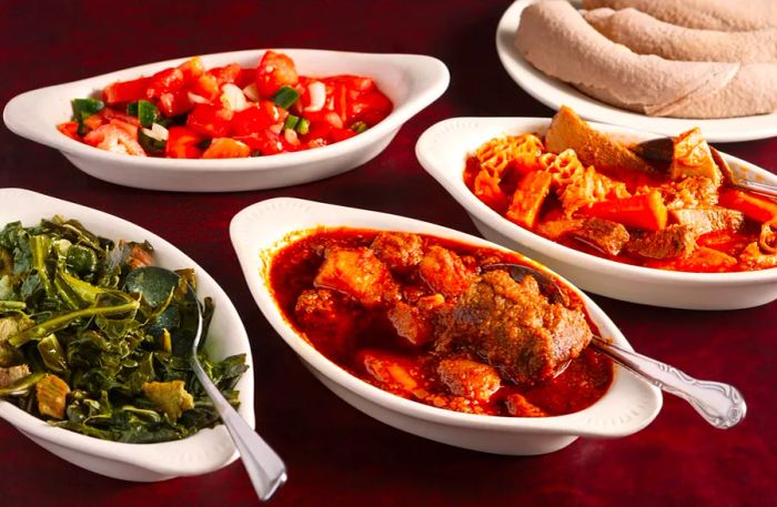 A variety of Ethiopian dishes served with rolled-up injera