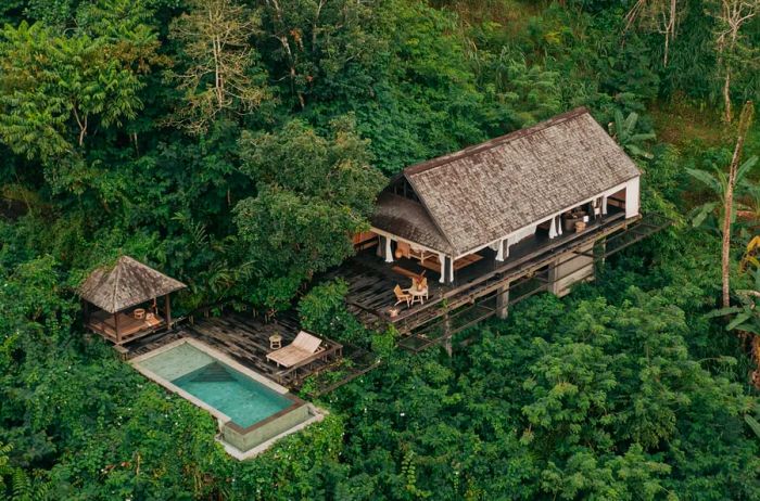 Aerial view showcasing a private pool and guest villa at Buahan.