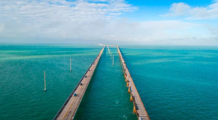 An aerial shot of the Seven Mile Bridge stretching over the ocean towards the lower Florida Keys.