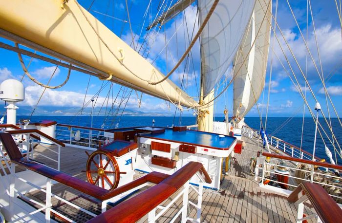 Aerial view of the majestic sailing ship 'Star Flyer' surrounded by vibrant royal-blue waters