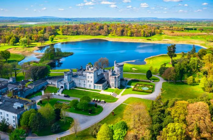 Dromoland Castle, complete with a golf course, stands majestically in County Clare on a summer day in Ireland.