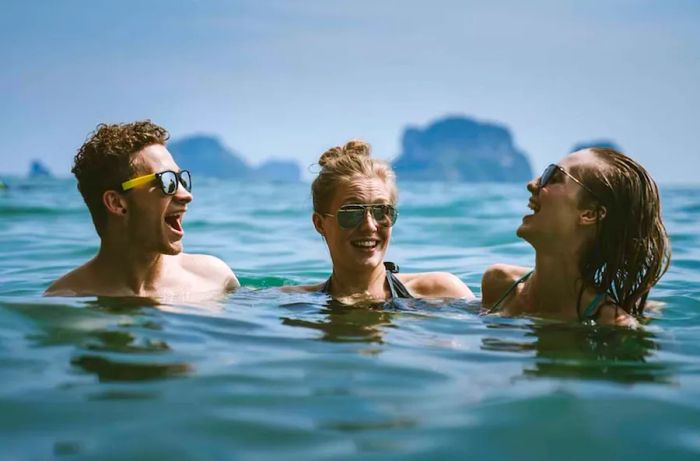 young adults enjoying swimming