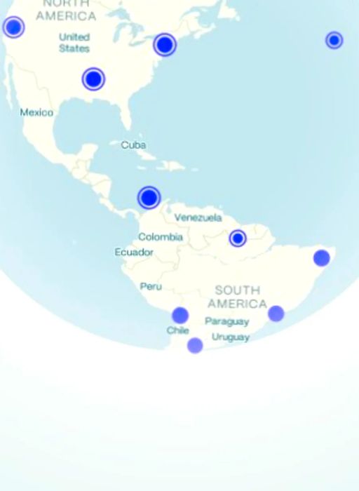 A screenshot of the Going mobile app, displaying a map of North and South America; purple dots highlight locations with available flight deals.