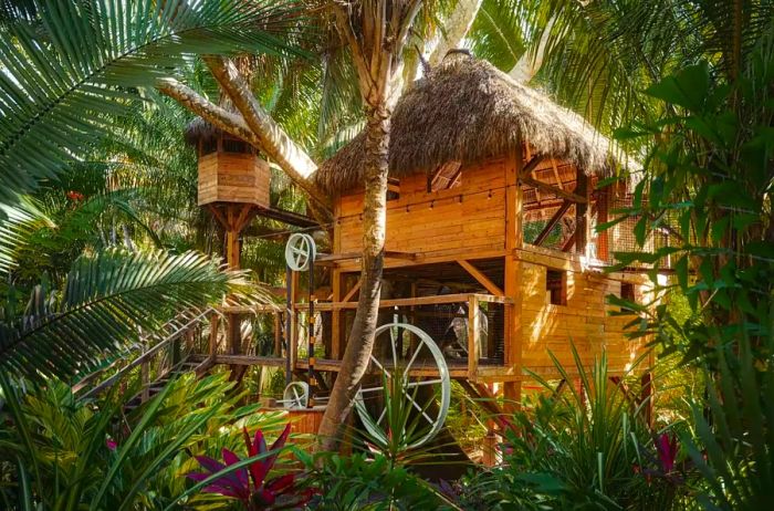 The jungle-themed playhouse at One&Only Mandarina is enveloped in lush greenery.