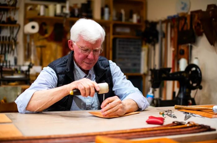 Jim Jackson crafts his creations at the Brinton Leather Shop