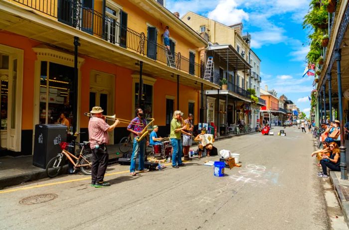 Jazz musicians performing on the streets of the historic French Quarter along Royal Street.