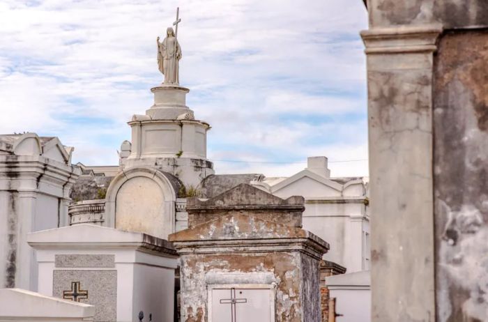 Stunning above-ground graves in the renowned St. Louis Cemetery No. 1 in New Orleans, Louisiana, where the grave of Marie Laveau, the Voodoo Queen, is located.