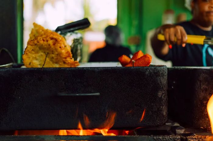 Savor genuine Puerto Rican street food in Piñones.