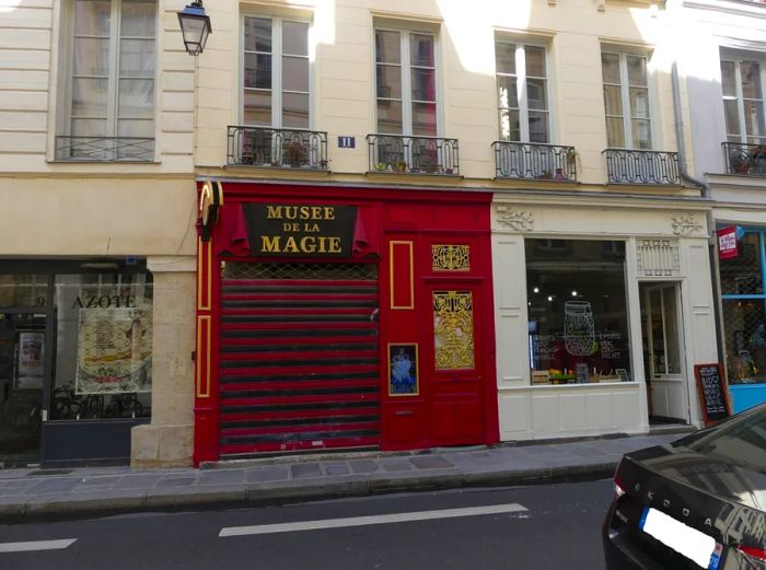 The striking red and white facade of the Museum of Magic.