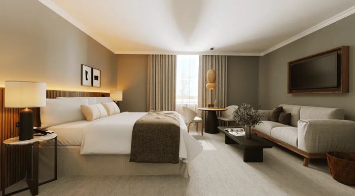 The interior of a room at Hotel Casa Lucia Buenos Aires features a bed with white linens, complemented by gray couches and walls.