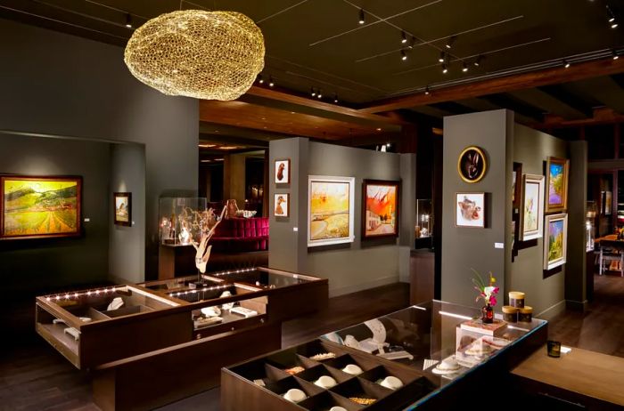 The interior of the art gallery features gray walls and wood-trimmed ceilings at the Grand Bohemian Lodge Greenville, South Carolina, U.S.