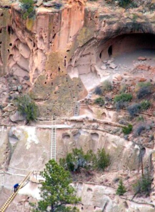 Steep cliffside dwellings linked by ladders at the Alcove House in Bandelier National Monument