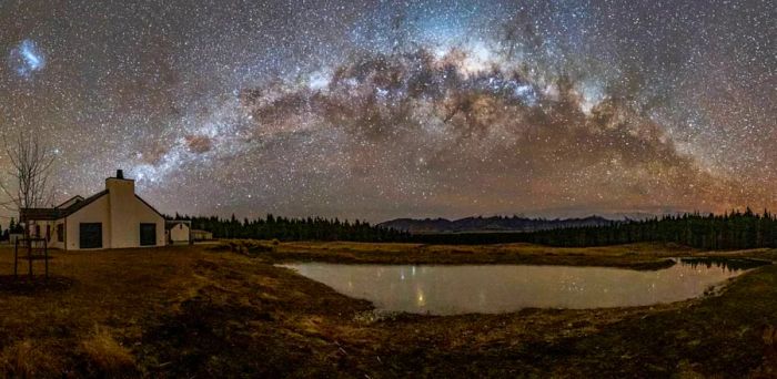 Experience the beauty of Mt. Cook Lakeside Retreat under clear, starry skies in New Zealand.