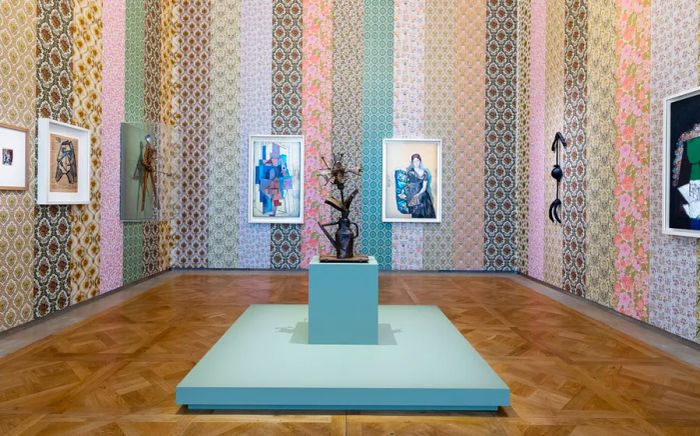 The permanent collection at the Musée National Picasso, curated by designer Paul Smith, is adorned with patterned pastel wallpaper.